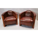 Pair of Art Deco style leather Aviator chairs.
