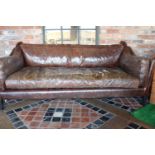 Retro style leather upholstered three seater sofa.