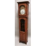 Early 20th C. oak long cased clock.