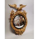 19th C. carved giltwood convex mirror.