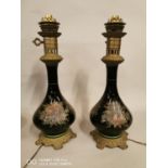 Pair of hand painted ceramic and brass table lamp.