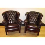 Pair of wing backed armchairs.