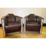 Pair of good quality aviator style armchairs.