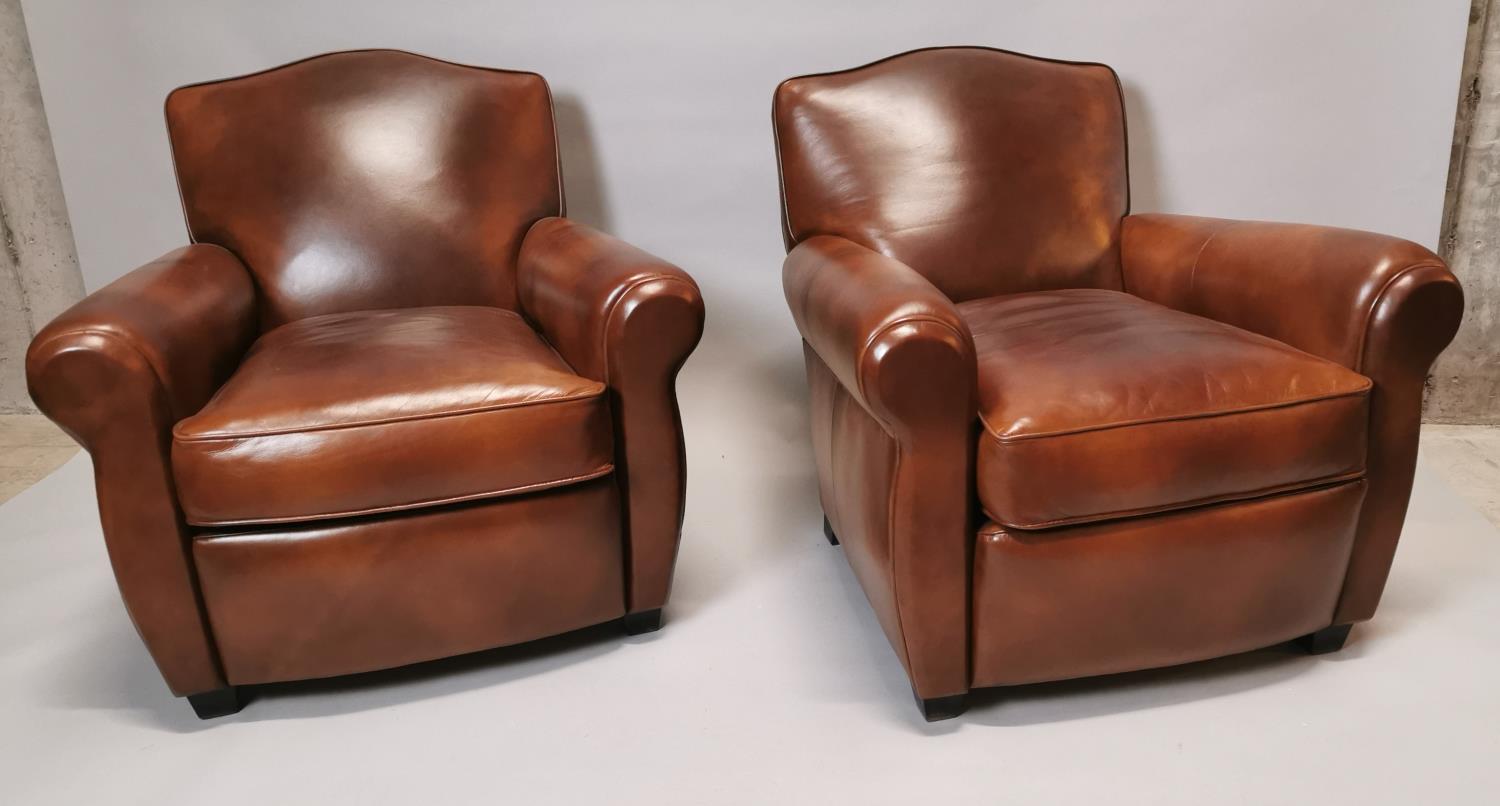 Pair of hand dyed leather club chairs.