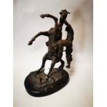 Bronze model of horse and rider mounted.