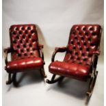 Pair of mid century mahogany and leather armchairs.