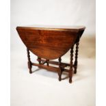 Edwardian oak drop leaf table.