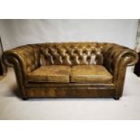 Leather deep buttoned Chesterfield sofa.