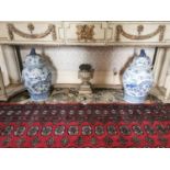 Pair of Oriental blue and white lidded vases.