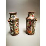 Pair of early 19th C. Famille Rose vases.