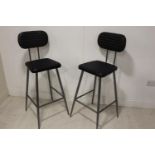 Set of four leather and metal counter stools.