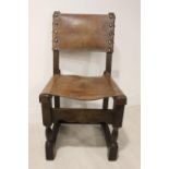 Oak and leather side chair.