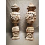 Pair of terracotta lidded urns.