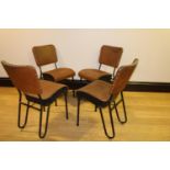 Set of four leather and metal chairs.