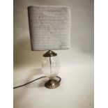 Glass and silver plate table lamp.