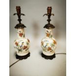 Pair of ceramic and brass table lamps.