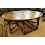 Oak drop leaf gate legged dining table.