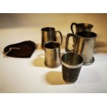Set of five pewter tankards and pipe rack.