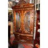 Carved mahogany Bombay display cabinet.