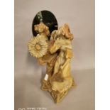 Terracotta figurine of a Lady with mirror.