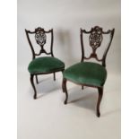 Pair of Edwardian mahogany carved armchairs.