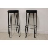Pair of metal and leather counter stools.