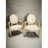 Pair of hand carved open armchairs.