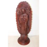 Carved mahogany statue.