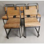 Set of five metal and wooden stacking chairs.