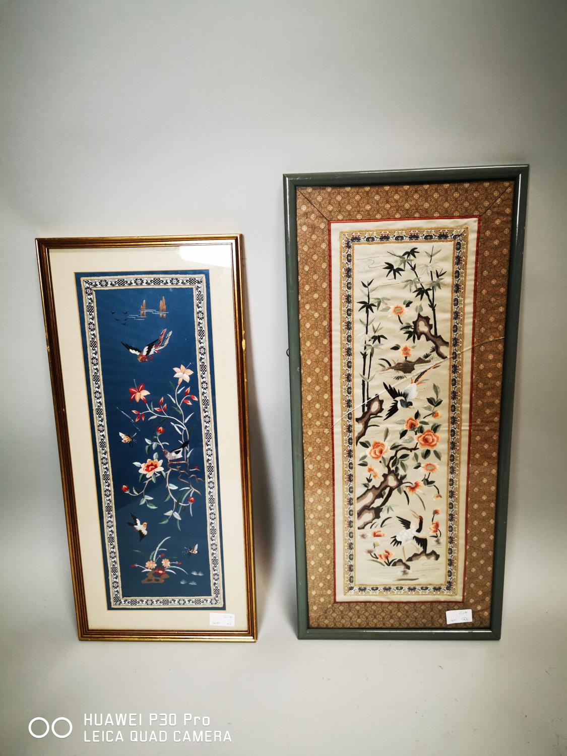 Two Oriental framed embroidered panels.