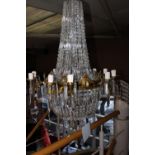 Brass and cut glass eighteen branch chandelier.