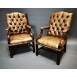 Pair of good quality deep buttoned armchairs.