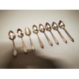 Set of eight German silver plated dessert spoons.
