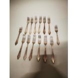 Set of eight German silver plated dessert forks and six dinner forks.