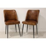 Pair of metal and leather side chairs.
