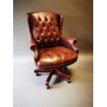 Leather deep buttoned swivel office chair.