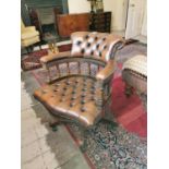 Leather and mahogany desk chair.