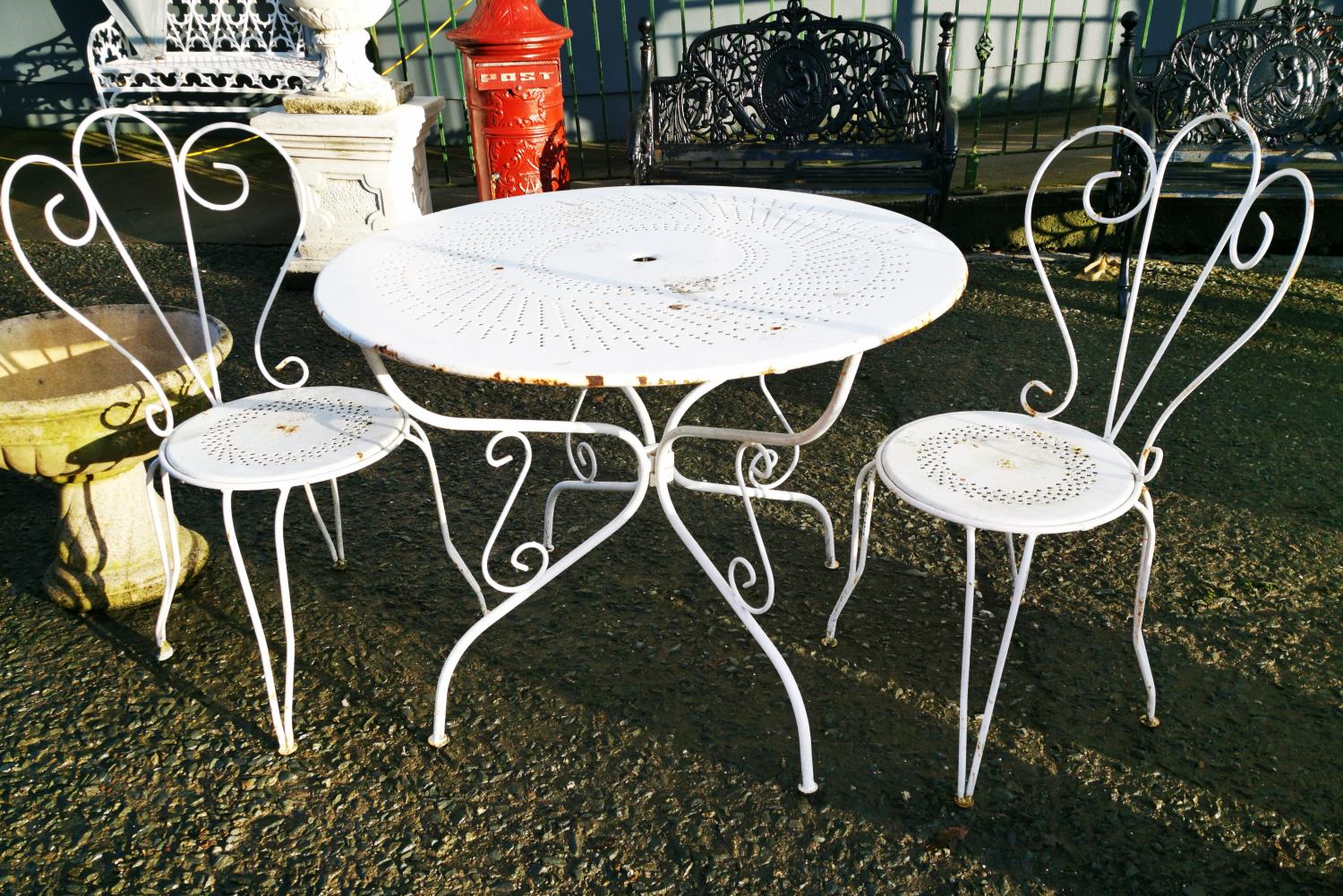 Early 20th C. metal garden table and two chairs.