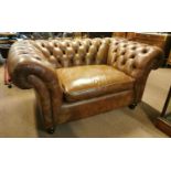 Leather deep buttoned Chesterfield sofa.