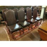 Set of eight oak and leather upholstered chairs.