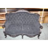 Upholstered wing back settee.