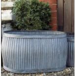 Pair of oval galvanised planters.