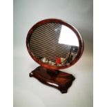 Walnut and mahogany dressing table mirror.