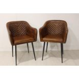 Pair of leather and metal arm chairs.