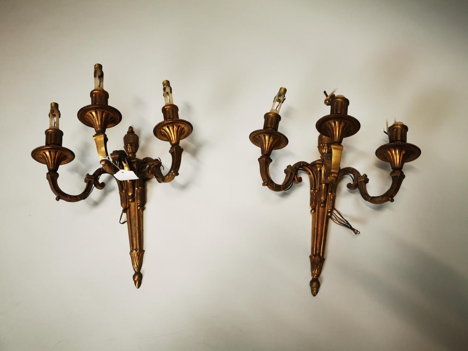 Pair of gilded brass wall sconces.