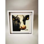 Framed oil on board of a Cow.