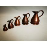 Set of five 19th C. graduated copper measures.