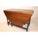 Late 19th C. oak double drop leaf table.