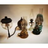 Collection of early 20th C. thumb lamps and a tilly lamp.