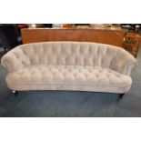 Upholstered three seater sofa.